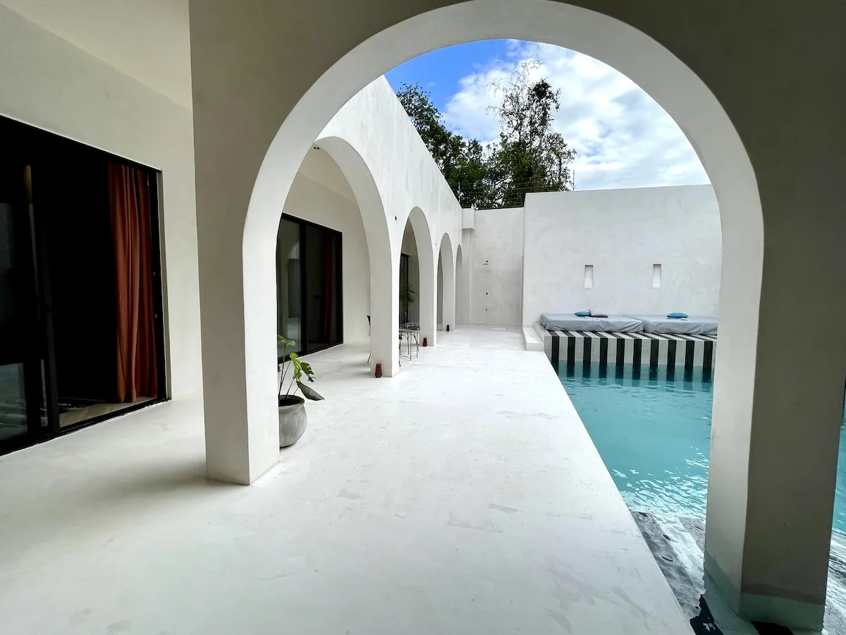 Casa Bali luxury swimming pool area with tropical garden and minimalist architecture