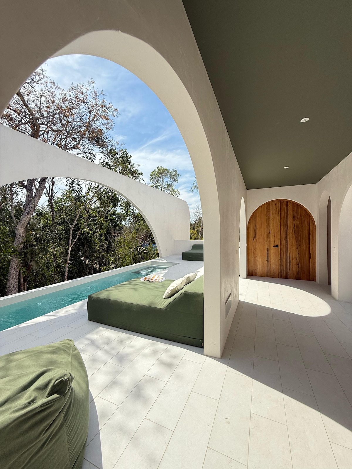 Casa Lancelot swimming pool area with tropical nature