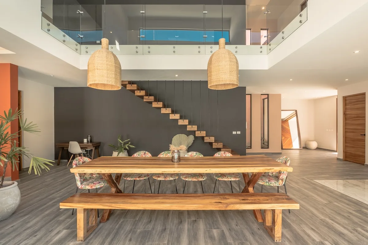 Casa Sueño modern living room with designer furnishings and jungle views in two-story rental villa