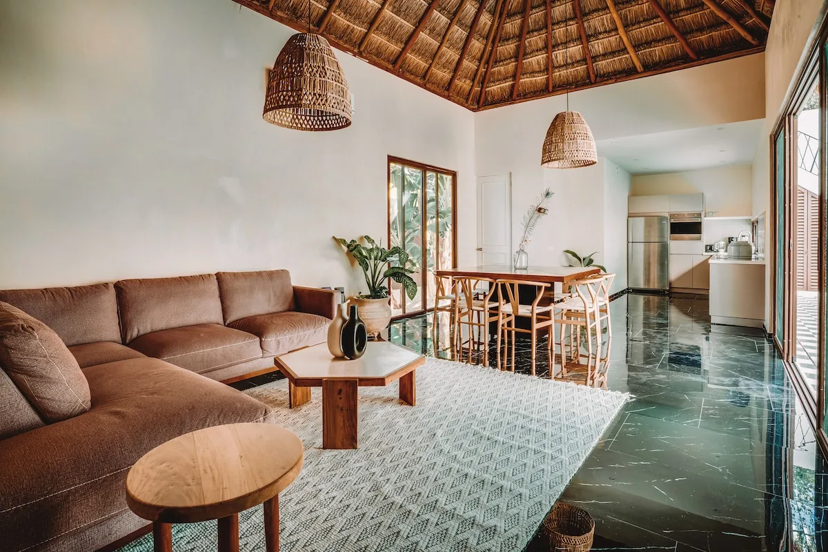 Casa Zorro interior featuring natural stone and wood accents with contemporary tropical design